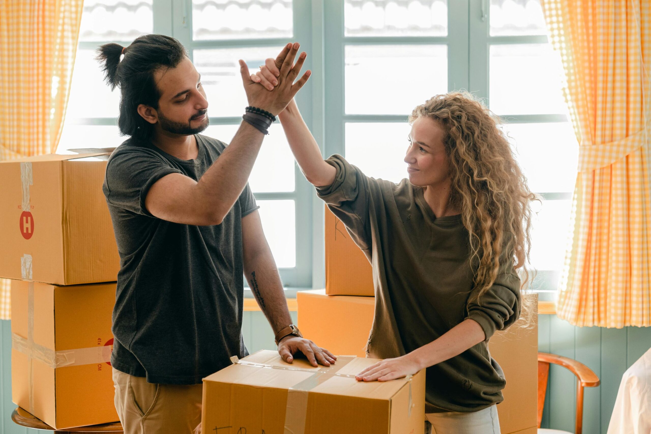 couples fixing moving boxes