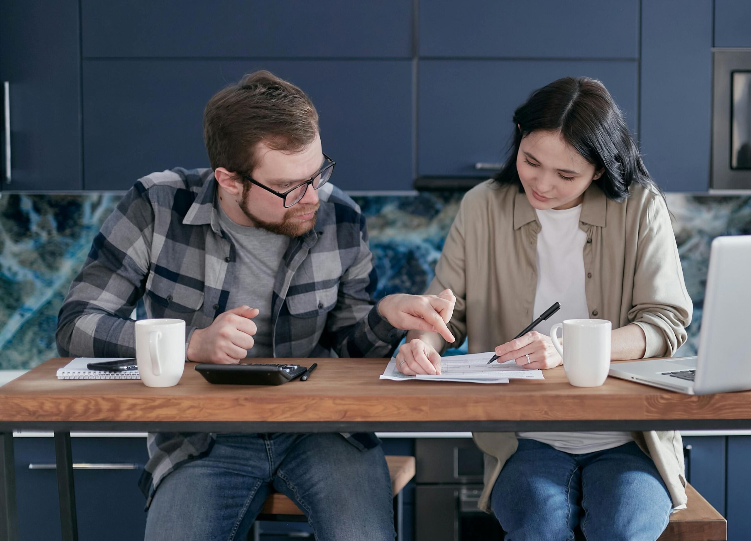 couple checking mortgage documents.