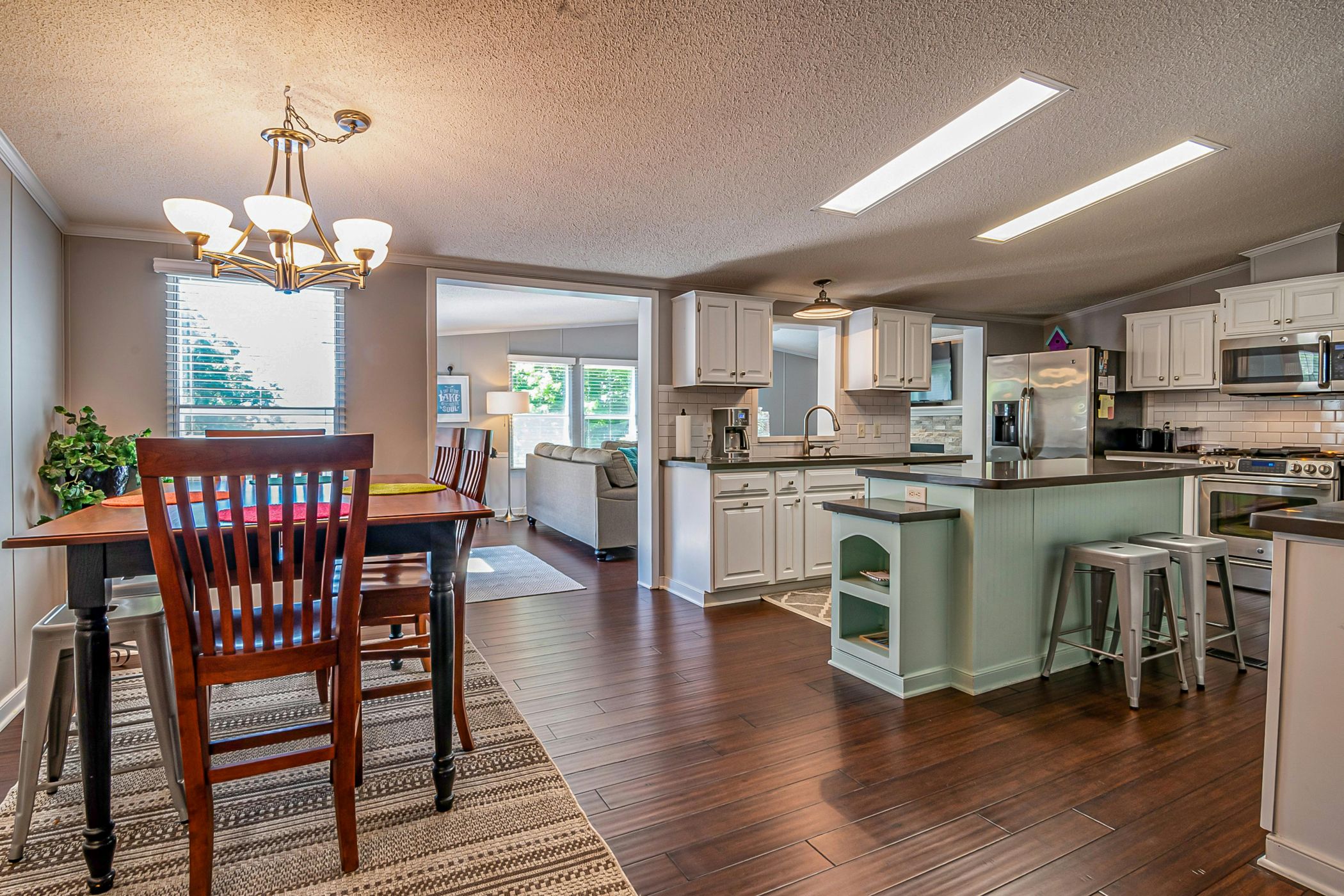 Inner view of dining and kitchen area of a house.
