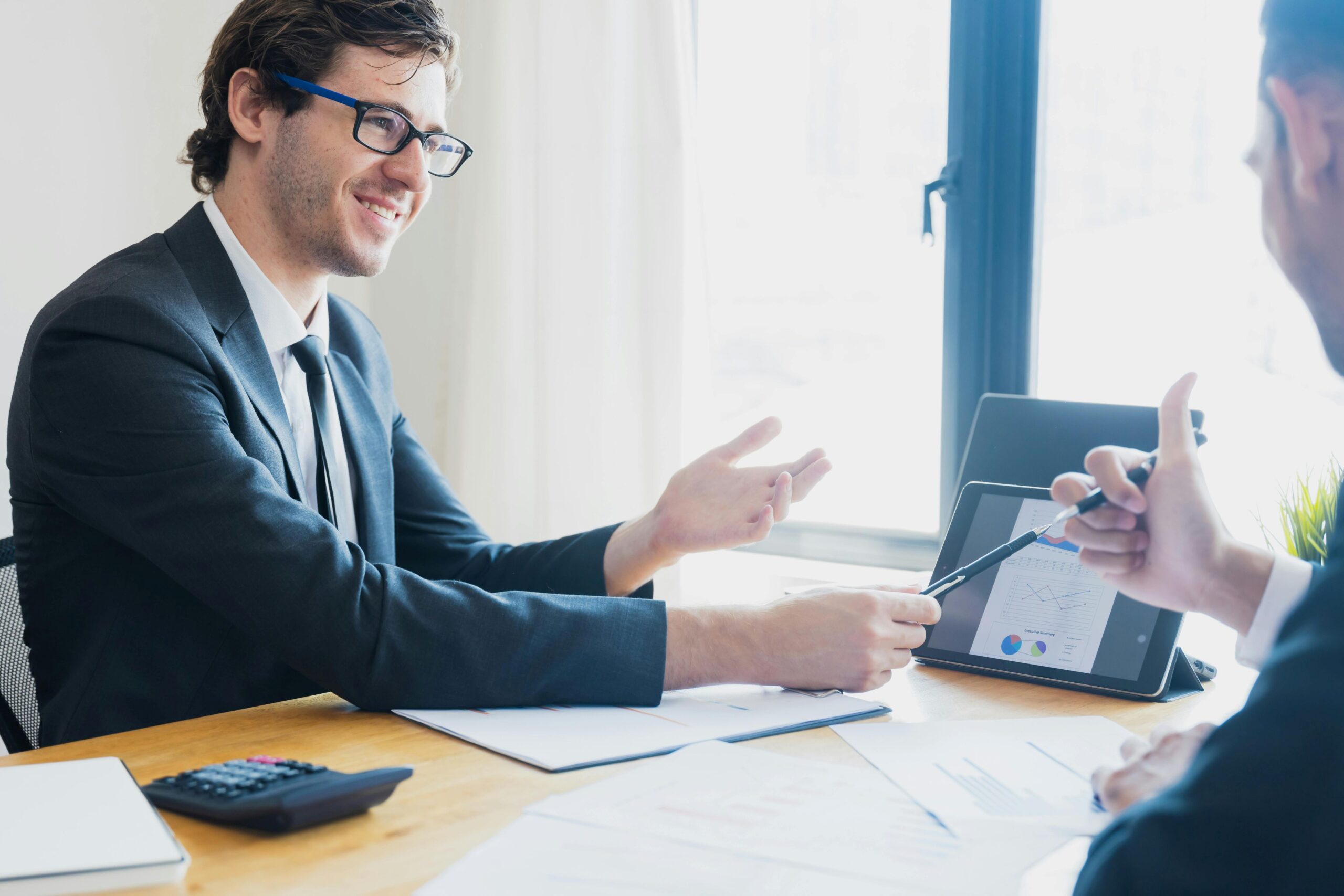 A male agent discussing with a client.