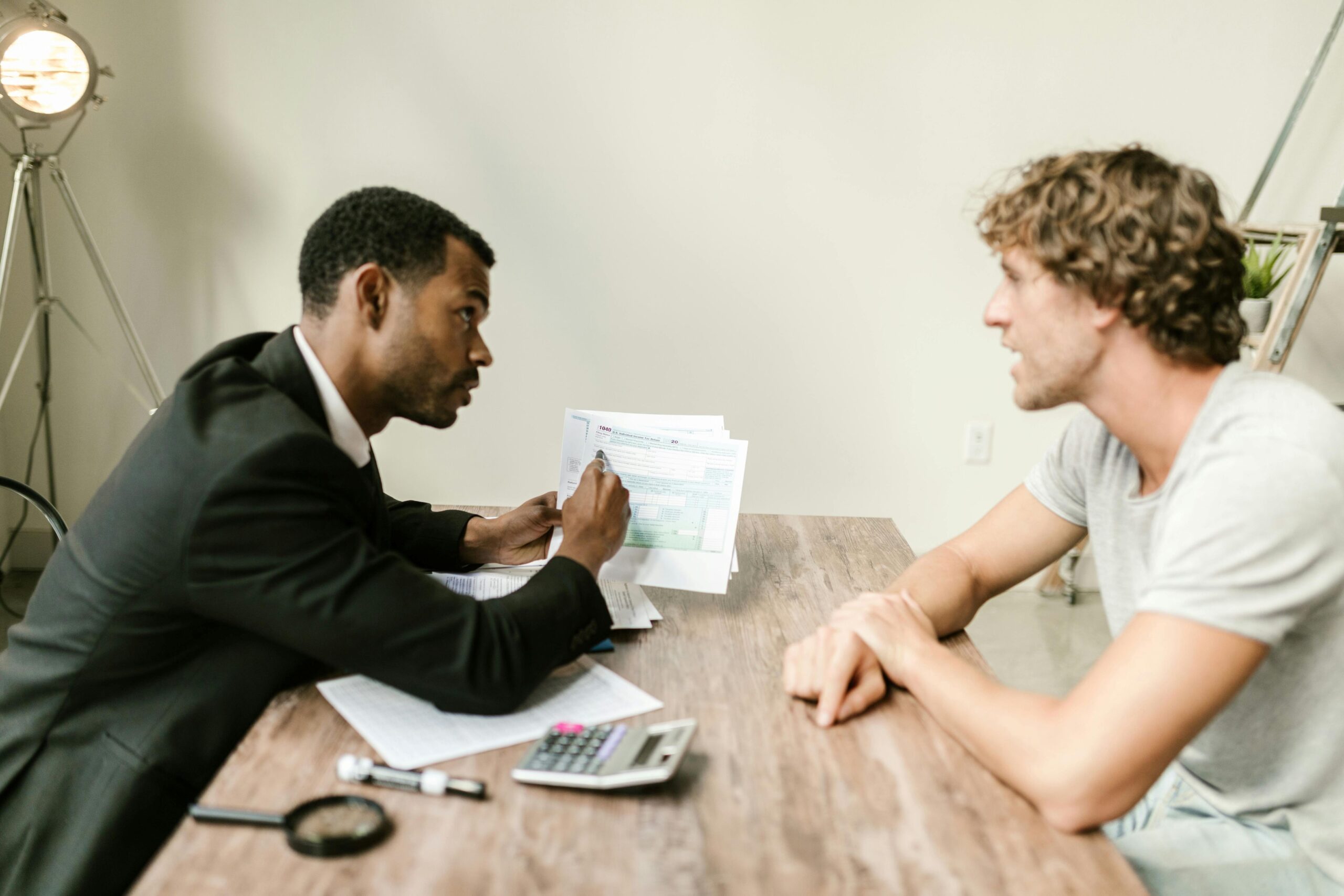 Male agent in discussion with client.