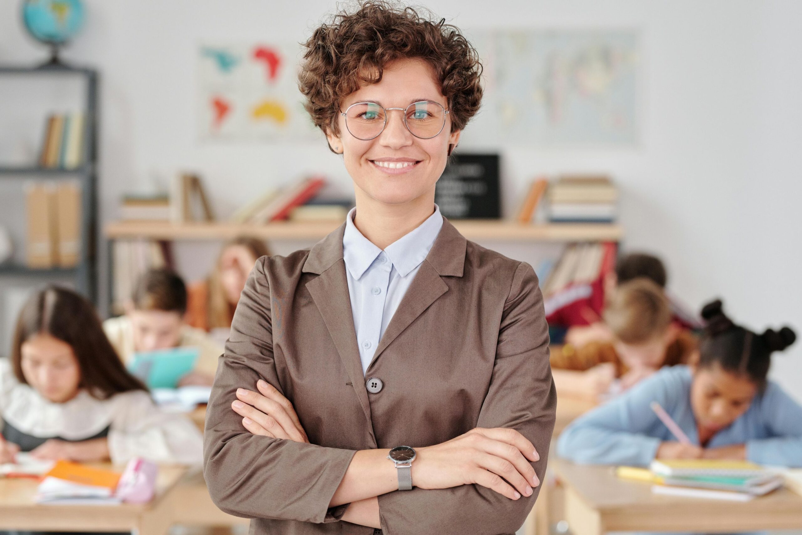 A female teacher standing in front of class.